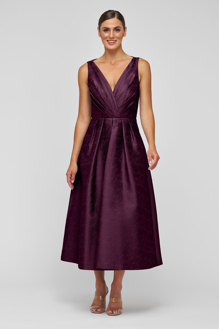 Woman wearing a purple dress on a white background