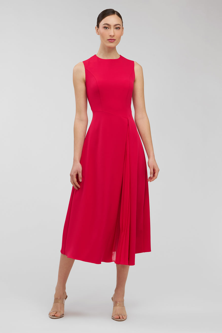 Woman wearing a red dress on a white background