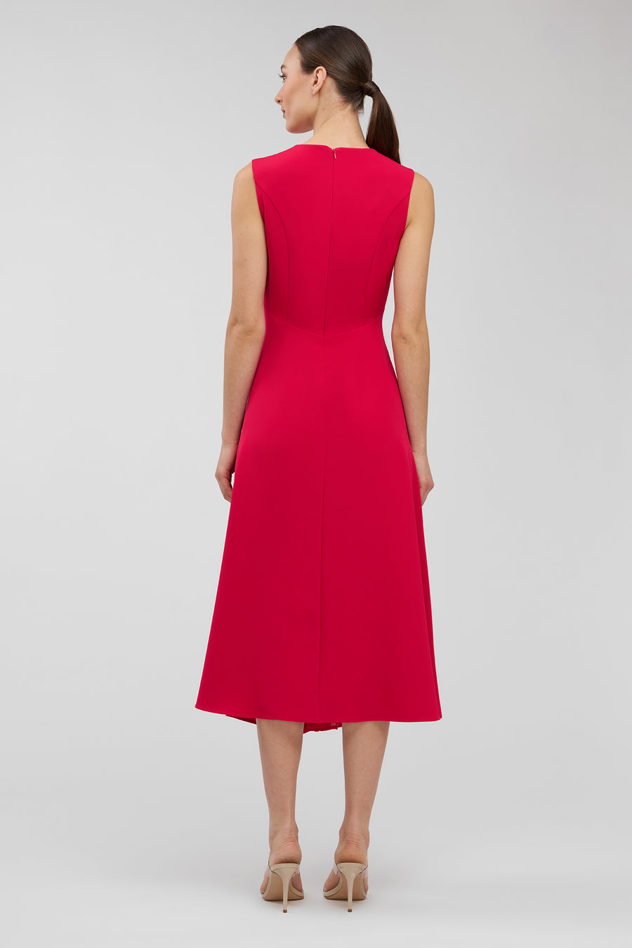 Woman wearing a red dress on a white background