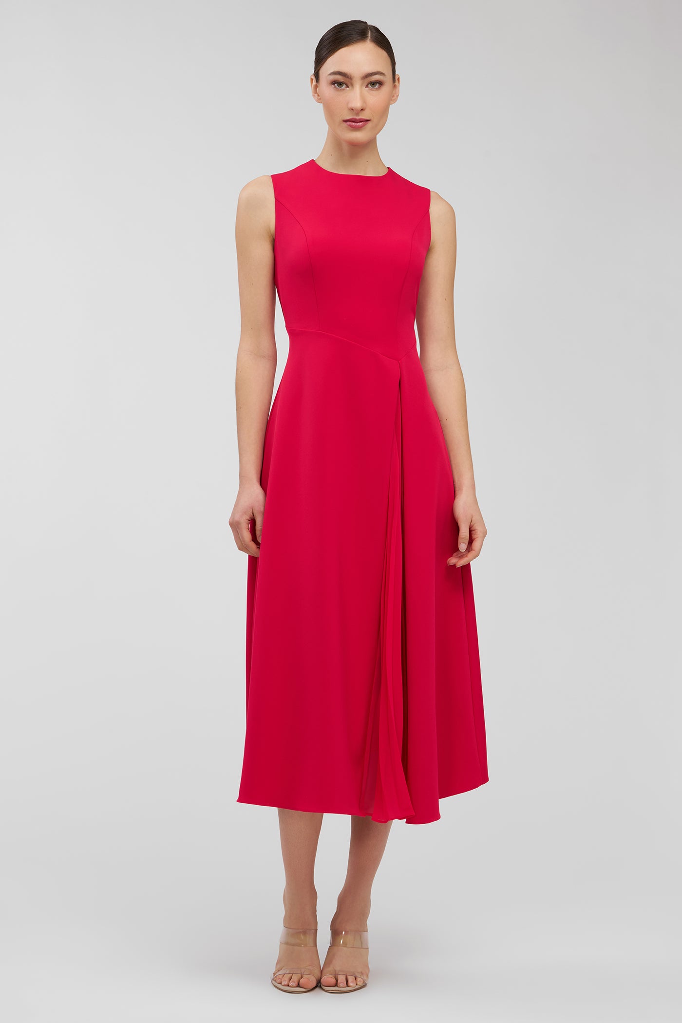 Woman wearing a red dress on a white background