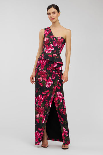 Woman wearing a floral one-shoulder dress on a white background