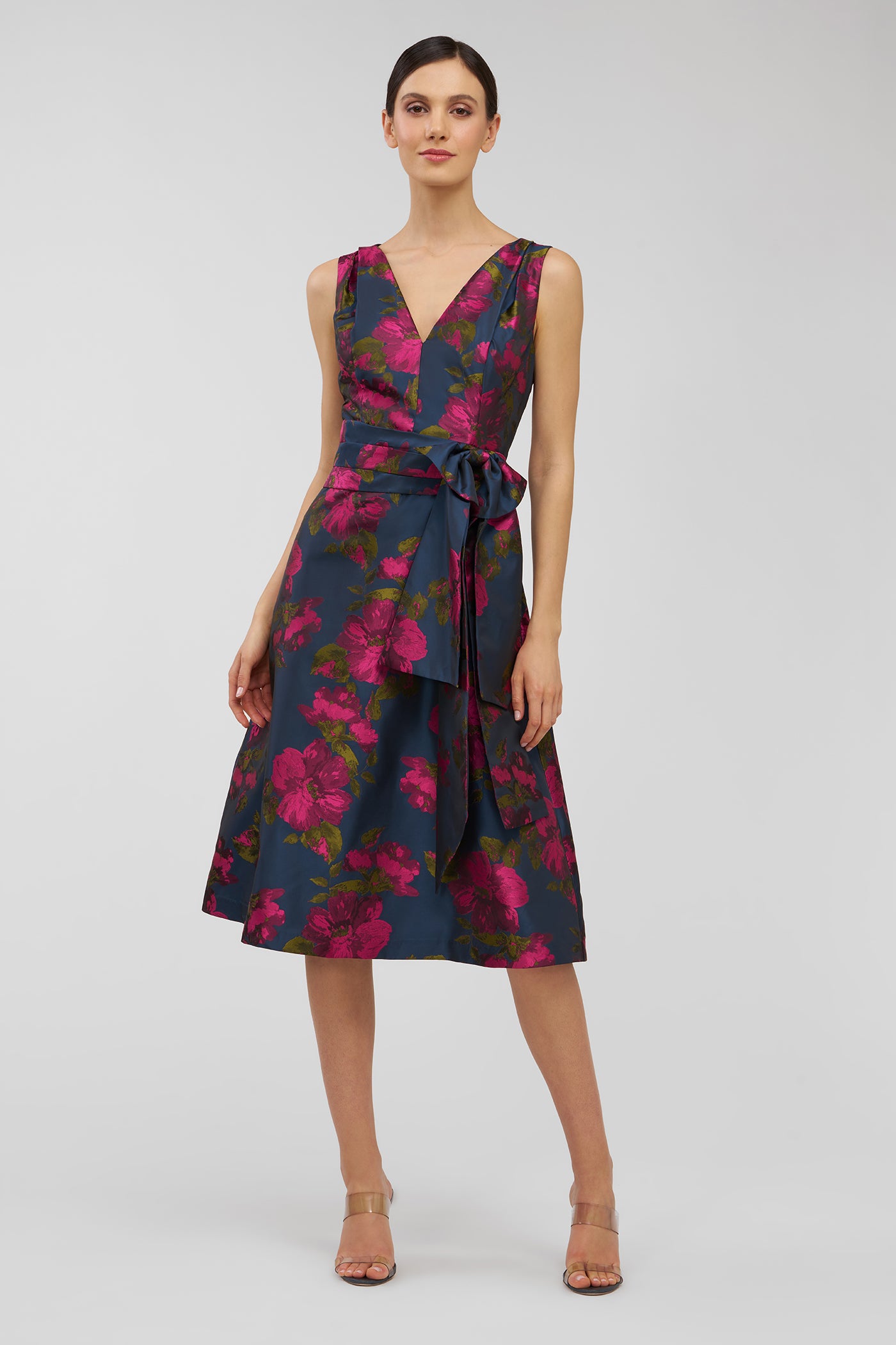 Woman wearing a floral dress on a white background