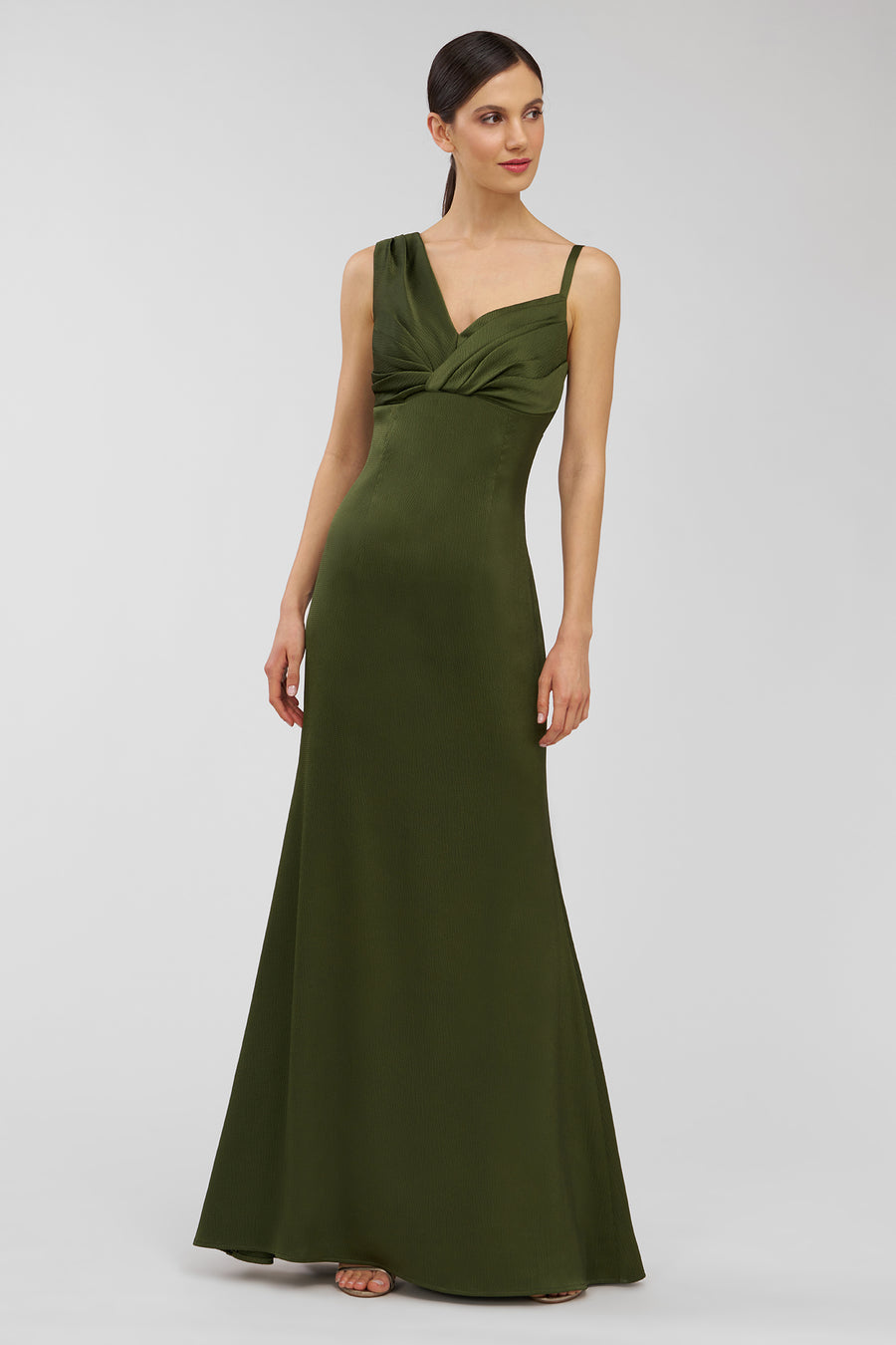 Woman wearing a green evening gown on a white background