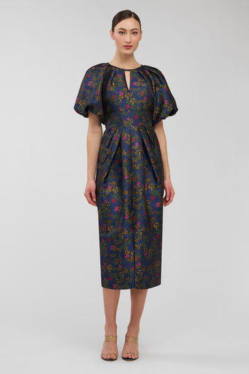 Woman wearing a floral dress on a white background