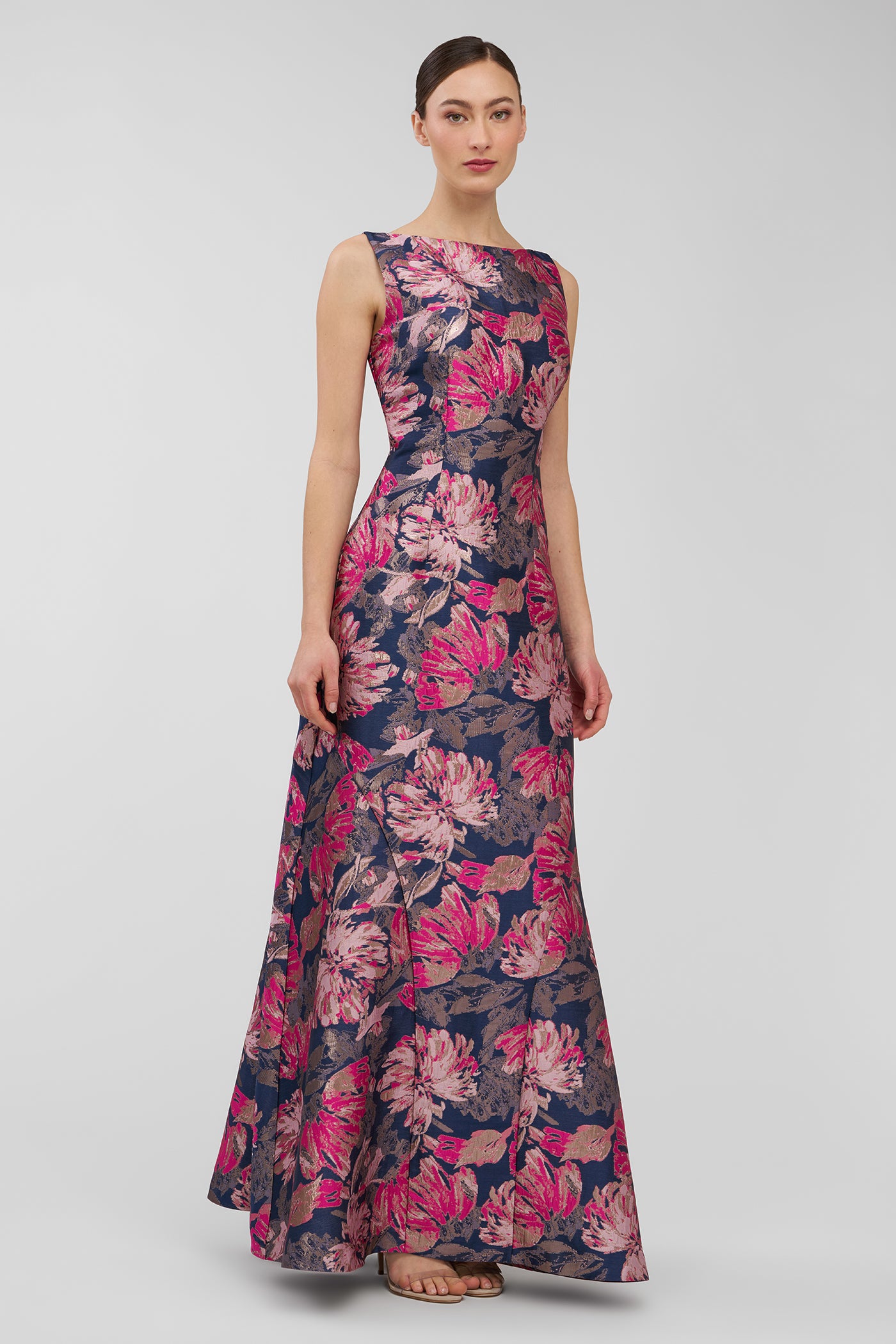 Woman wearing a floral dress on a light gray background