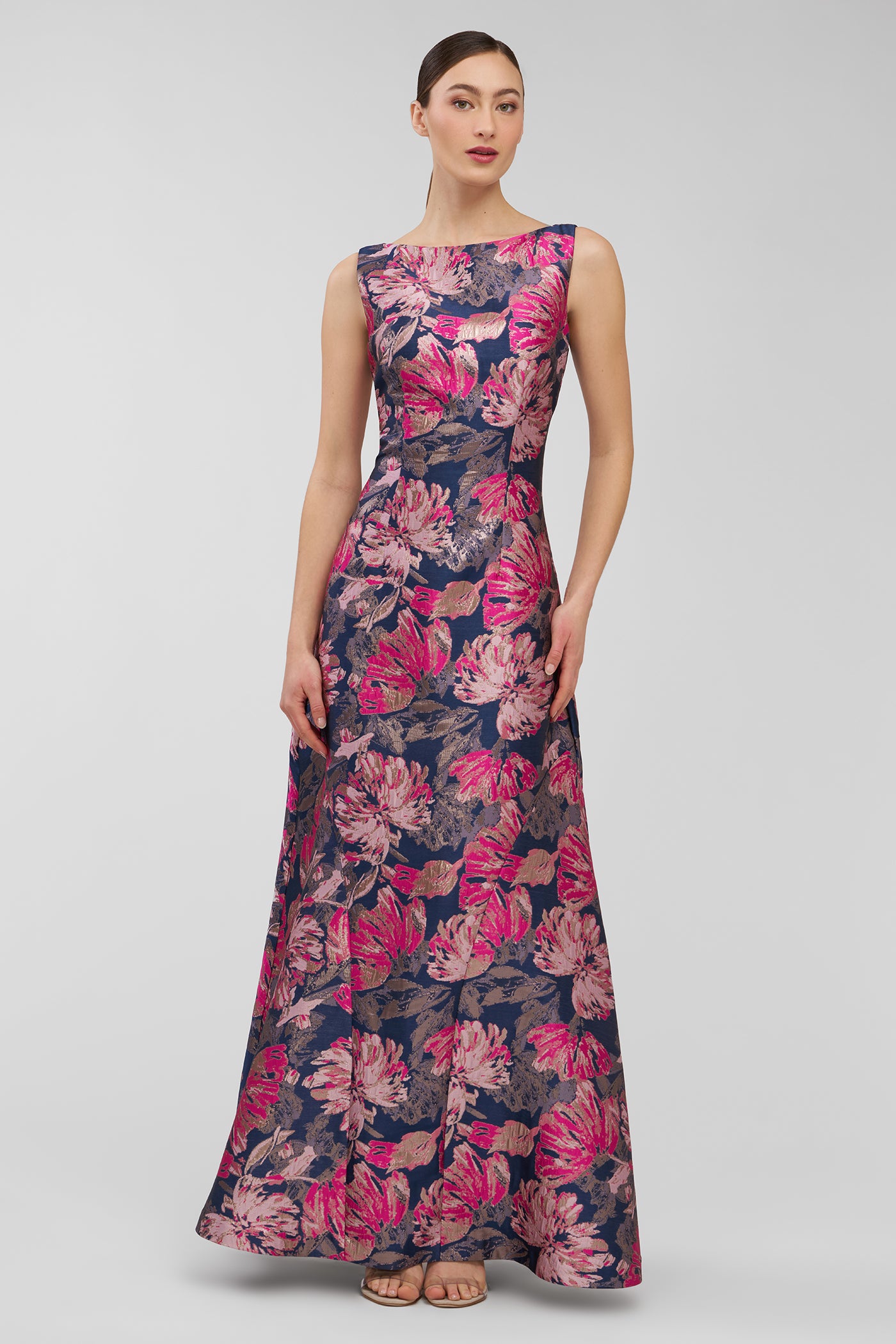 Woman wearing a floral dress on a plain background