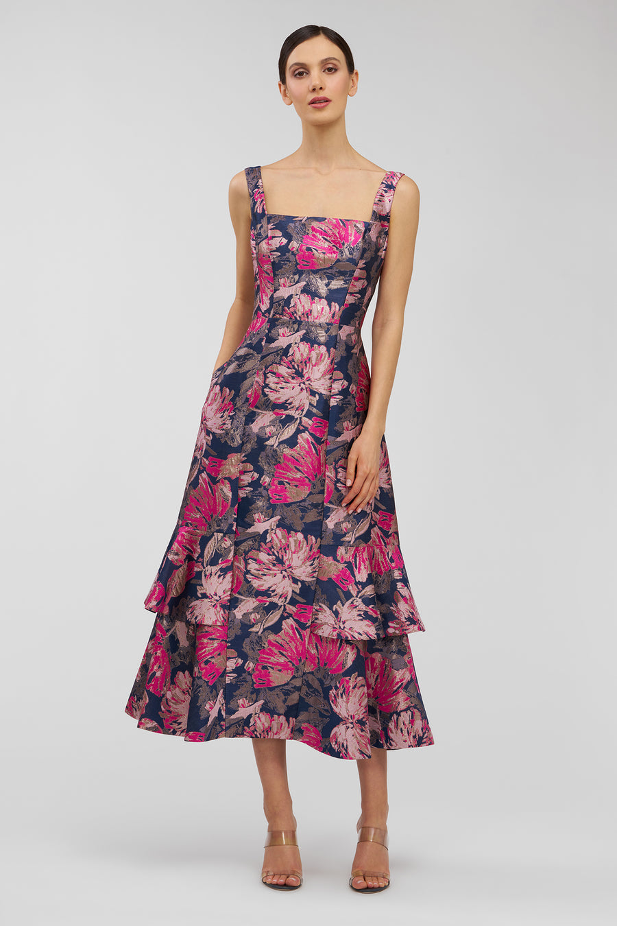 Woman wearing a floral dress on a white background