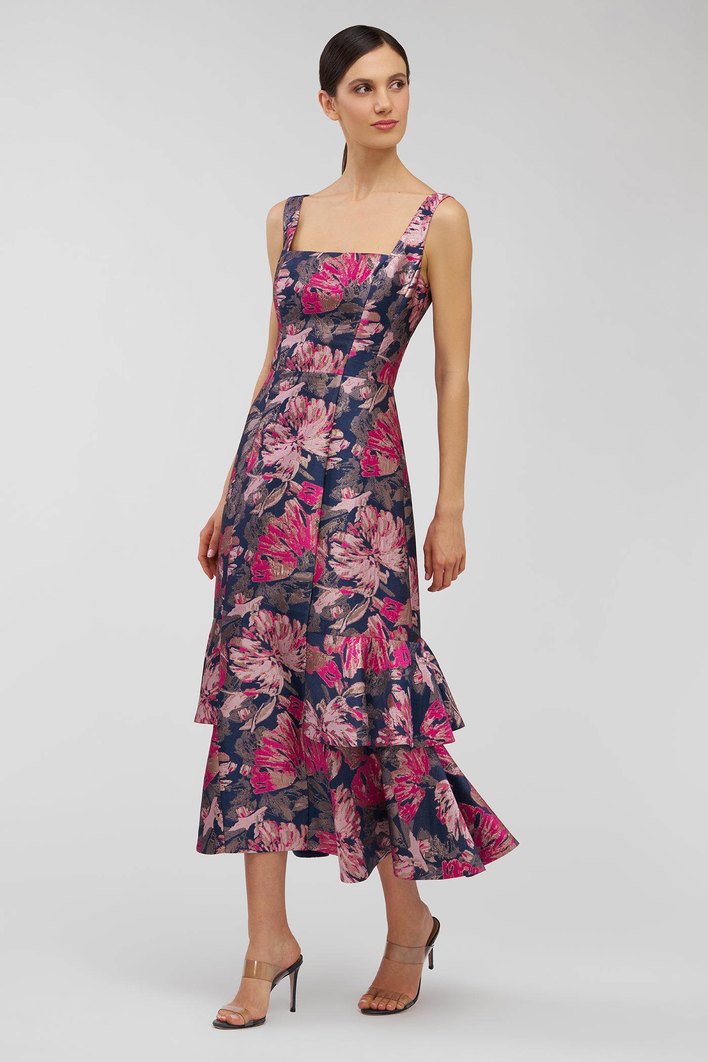 Woman wearing a floral dress on a white background