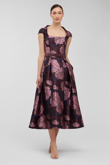 Woman wearing a floral dress on a white background